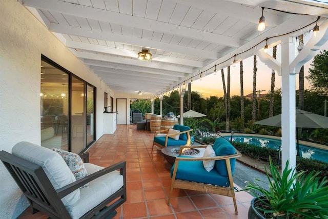 view of patio terrace at dusk