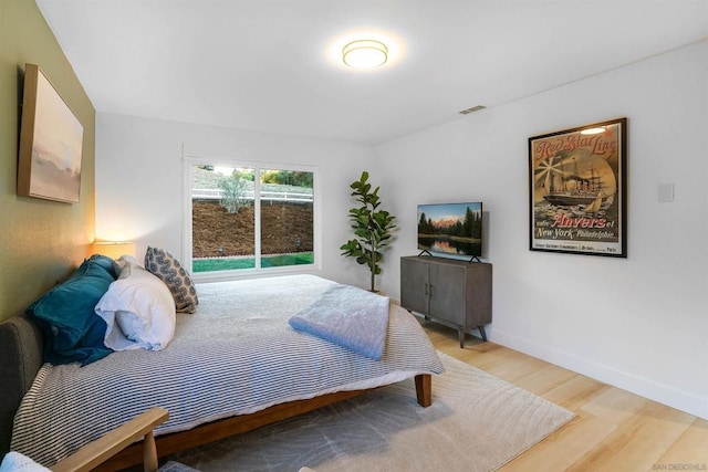 bedroom featuring wood-type flooring