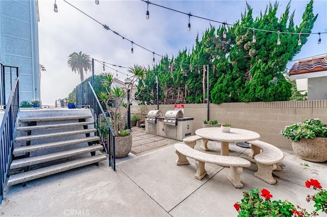 view of patio / terrace featuring outdoor dining area, a fenced backyard, and a grill