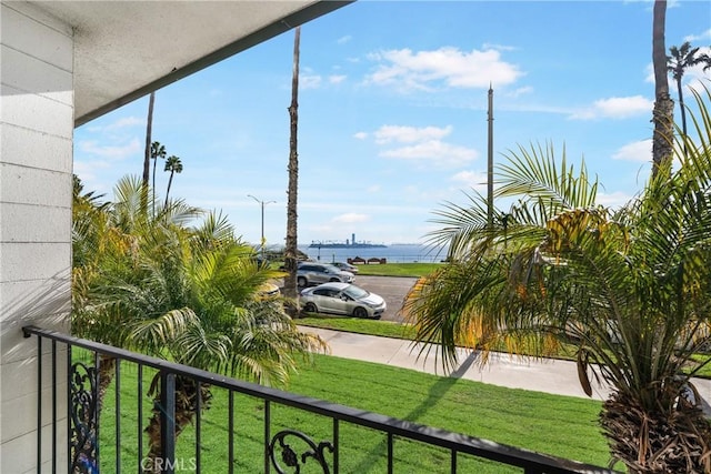 balcony featuring a water view