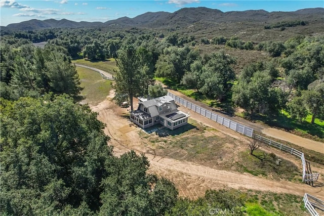 birds eye view of property featuring a mountain view