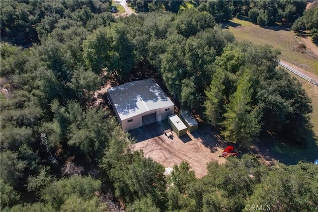 drone / aerial view with a view of trees