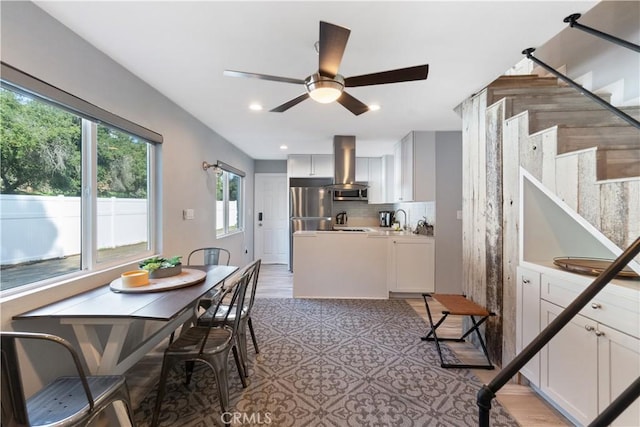 dining room with stairway, a ceiling fan, and recessed lighting