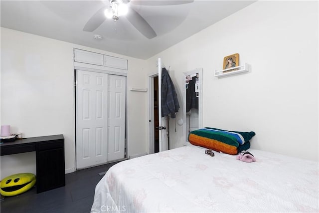 bedroom with ceiling fan and a closet