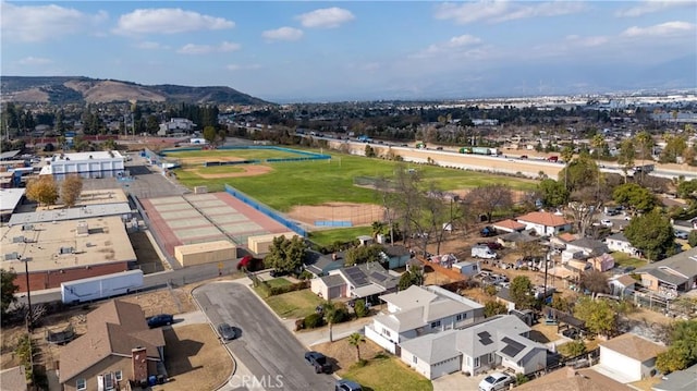 birds eye view of property with a mountain view