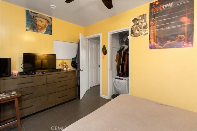 bedroom featuring ceiling fan and a closet