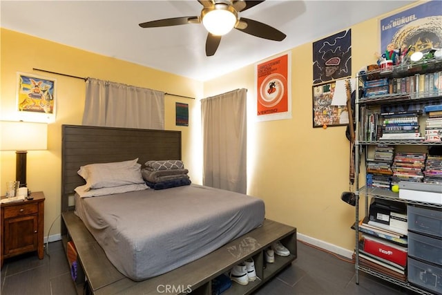 tiled bedroom with ceiling fan