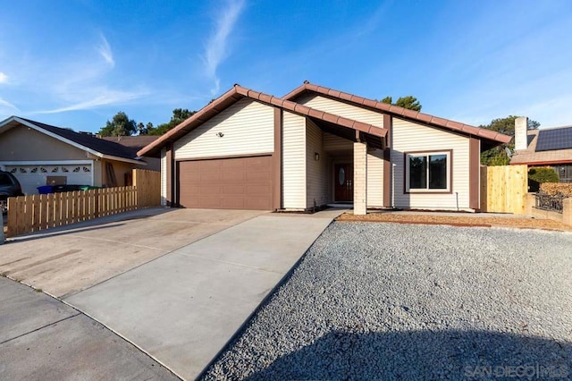 ranch-style house featuring a garage