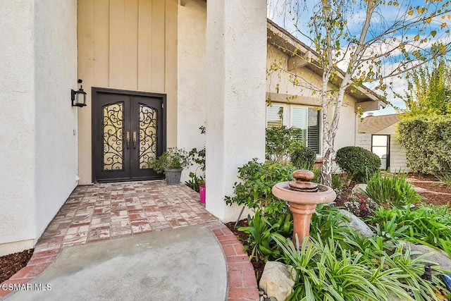 property entrance featuring french doors