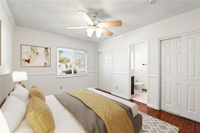 bedroom with ceiling fan, ensuite bathroom, and ornamental molding