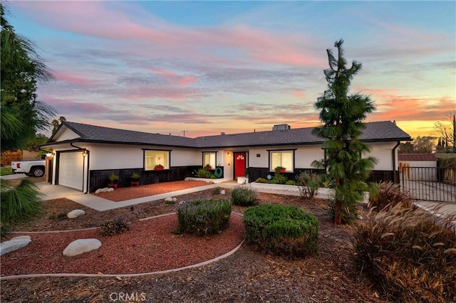 ranch-style house featuring a garage