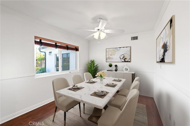 dining room featuring ceiling fan, dark hardwood / wood-style floors, and ornamental molding