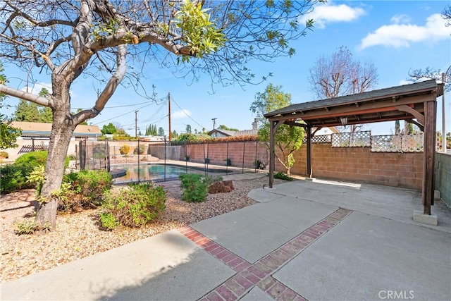 view of patio / terrace with a gazebo and a fenced in pool