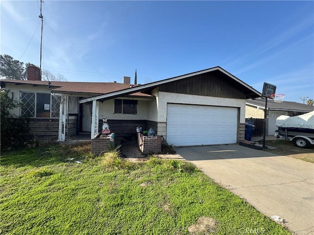 ranch-style home with a garage and a front lawn