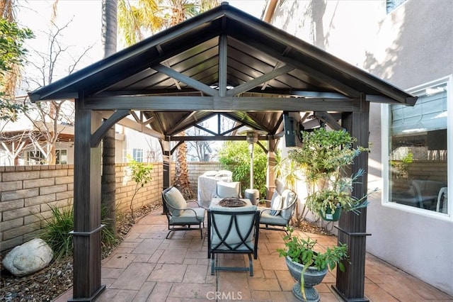 view of patio / terrace with a gazebo and an outdoor fire pit