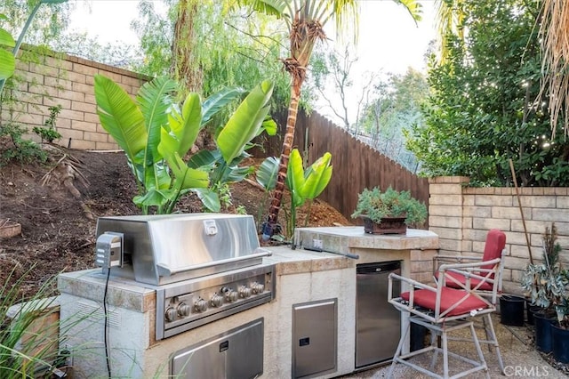 view of patio with a grill and area for grilling