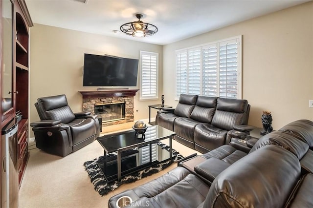 carpeted living room with a fireplace