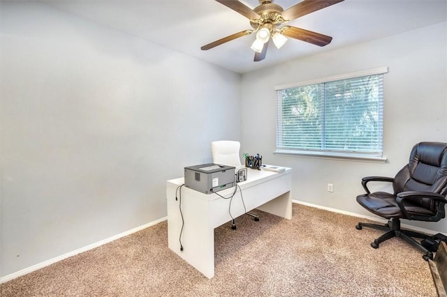 carpeted office featuring ceiling fan