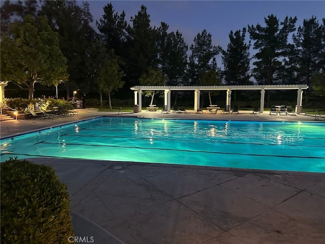 view of swimming pool featuring a pergola and a patio