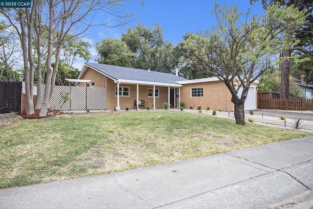 ranch-style home with a front lawn