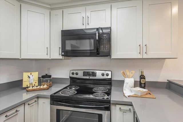 kitchen with white cabinets and electric stove