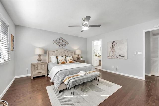 bedroom with ceiling fan, ensuite bath, and dark wood-type flooring