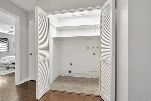 clothes washing area with washer hookup, dark hardwood / wood-style floors, and hookup for an electric dryer