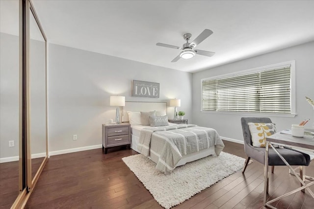 bedroom with ceiling fan, dark hardwood / wood-style flooring, and a closet