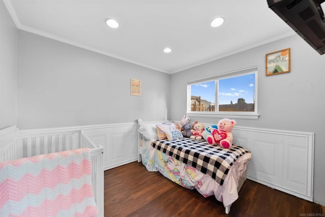 bedroom featuring dark wood-type flooring and ornamental molding