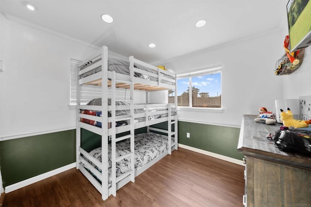 bedroom featuring dark wood-type flooring and crown molding