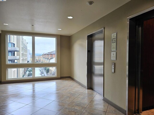 tiled empty room with elevator