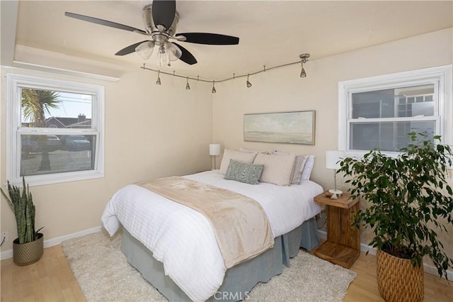 bedroom featuring ceiling fan and light hardwood / wood-style floors