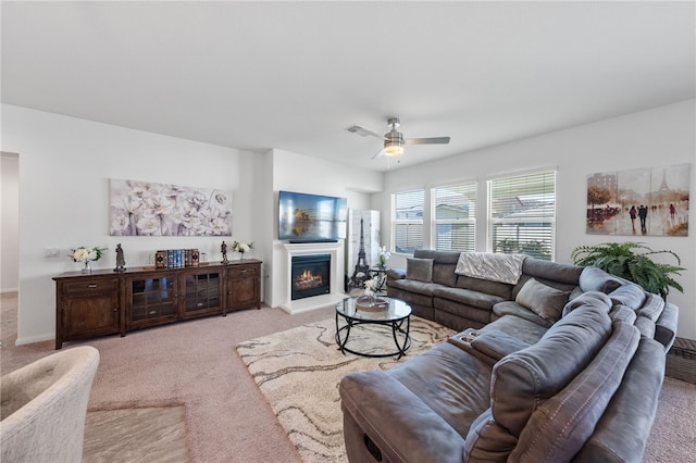 living room with ceiling fan and light colored carpet