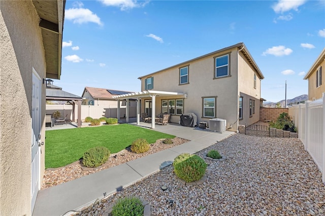 back of house with a yard, a pergola, central AC unit, a gazebo, and a patio