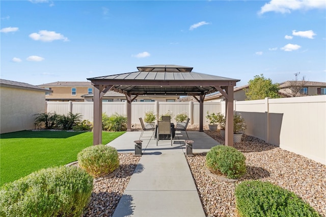 view of community featuring a gazebo, a lawn, and a patio