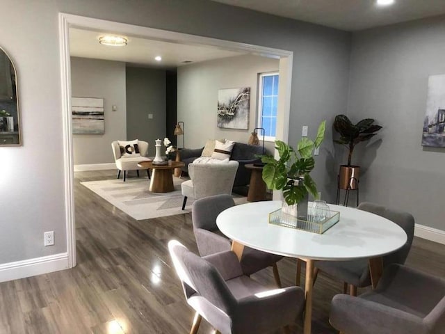 dining area with hardwood / wood-style flooring