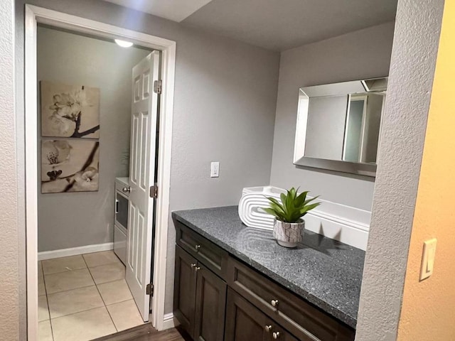 bathroom with vanity and tile patterned flooring