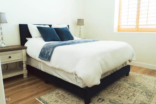 bedroom featuring wood-type flooring