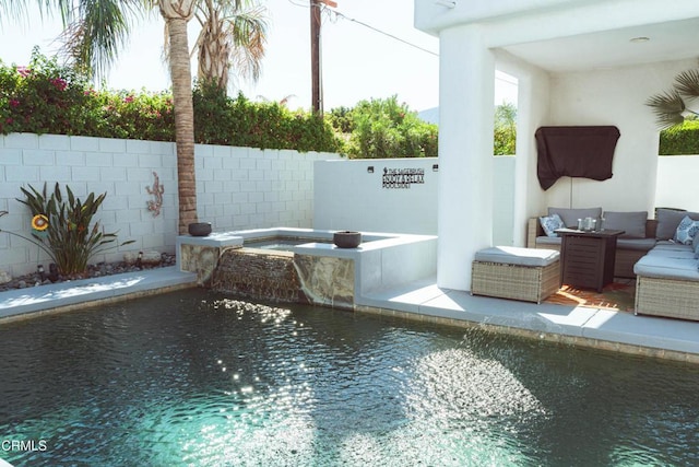 view of pool with an in ground hot tub