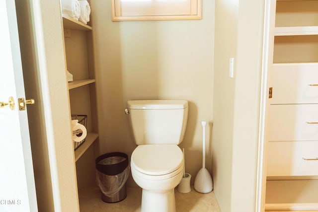 bathroom featuring tile patterned flooring and toilet