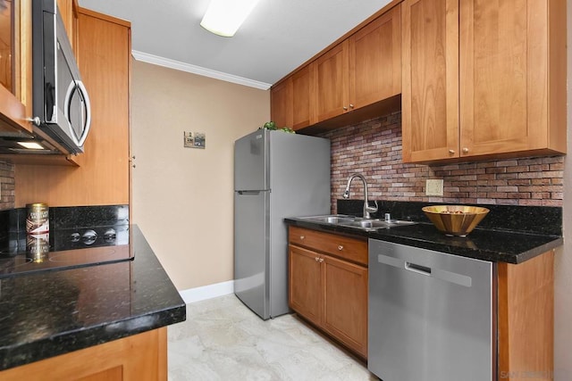 kitchen featuring sink, crown molding, dark stone counters, stainless steel appliances, and backsplash