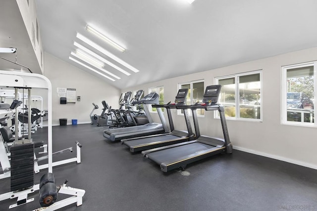 gym featuring high vaulted ceiling