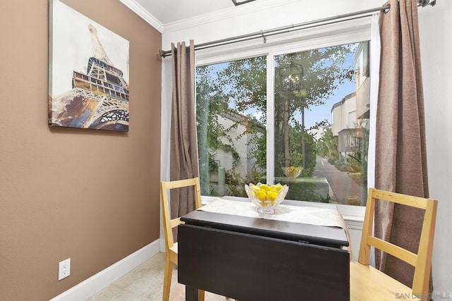 dining room featuring ornamental molding