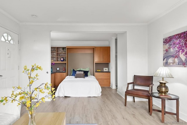 bedroom featuring ornamental molding and light wood-type flooring