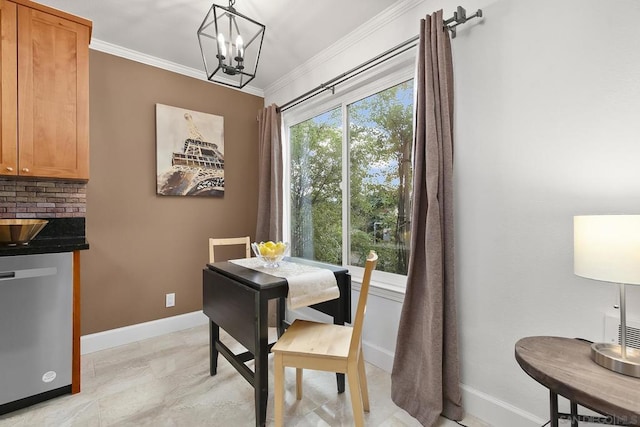 dining room featuring crown molding and a notable chandelier