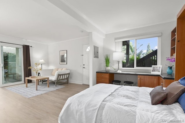 bedroom featuring crown molding, light hardwood / wood-style flooring, and access to outside