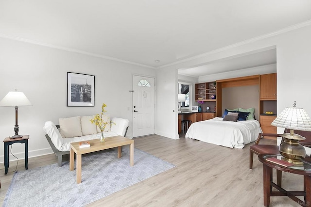 bedroom featuring light hardwood / wood-style flooring and ornamental molding