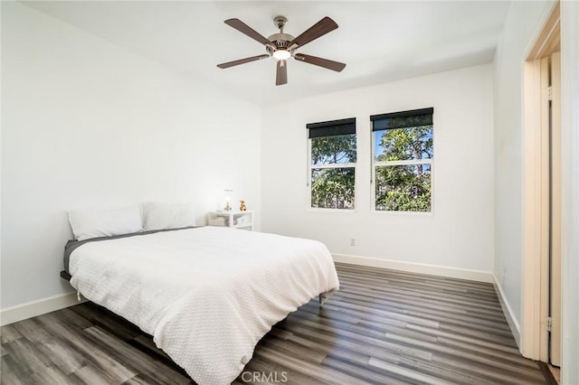 bedroom featuring ceiling fan and dark wood-type flooring