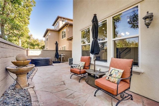 view of patio with a hot tub