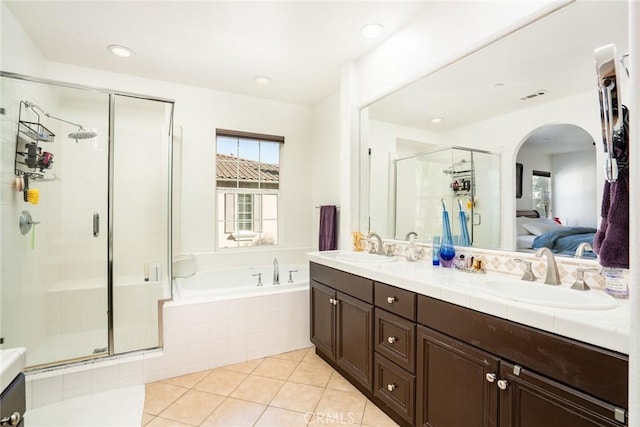 bathroom with vanity, tile patterned flooring, and separate shower and tub